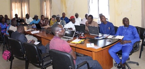 This image shows people gathered at a table indoors. 